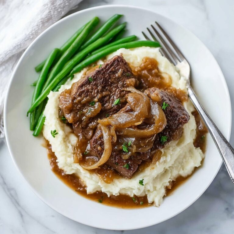 Creamy Cube Steak with Caramelized Onions in Rich Gravy Recipe